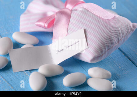 sugared almonds for baptism on the blue table Stock Photo