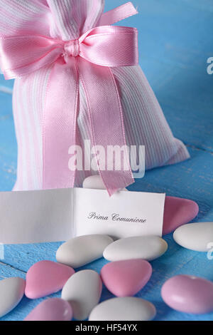 sugared almonds for baptism on the blue table Stock Photo