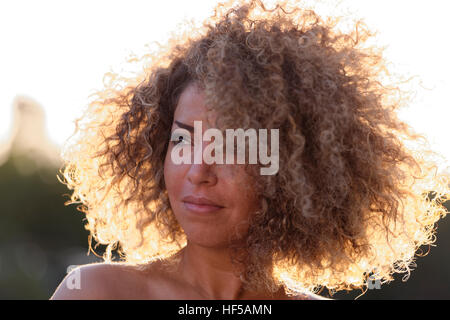 Young woman with curly hair, Germany Stock Photo