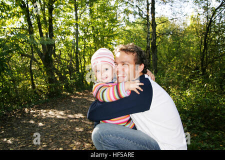 Father and his three-year-old daughter, hugging Stock Photo