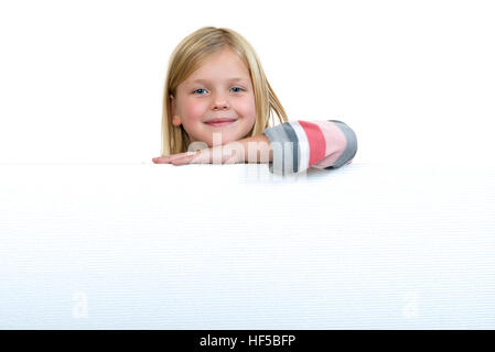 Cute blonde girl holding a blank sign Stock Photo