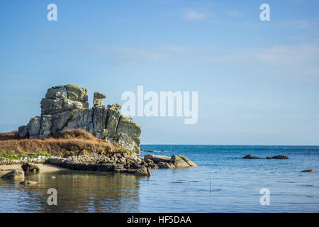 The loaded camel at high tide in Porth Hellick, St Mary's, Isles of Scilly, March 2015 Stock Photo