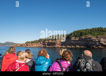 Tourists on a boat arriving on Bonaventure Island, Gaspe Peninsula, Quebec, Stock Photo