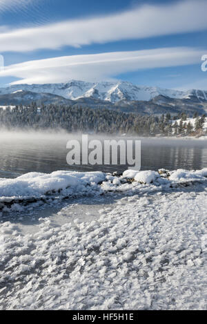 Wallowa Lake steaming on a cold winter morning, Wallowa Valley, Oregon. Stock Photo