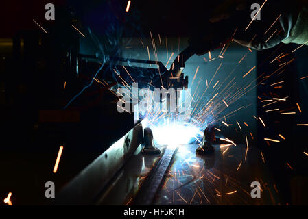 Welding robots movement in a car factory welding robot welding splashes brews argon Stock Photo