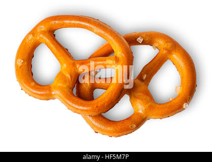 Two crunchy pretzels with salt on each other isolated on white background Stock Photo