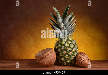 pineapple and coconut on the wooden table Stock Photo