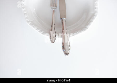 empty plate with knife and fork - beautiful cutlery Stock Photo