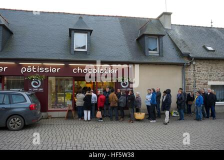 Christmas eve queues outside a french bakery Stock Photo