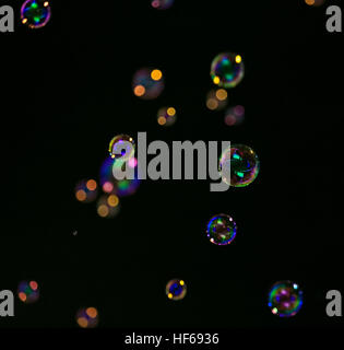 Lot of soap bubbles on a dark background Stock Photo