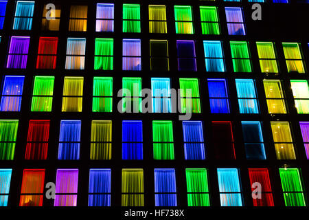 Colored windows texture. Windows illuminated by neon lights background ...