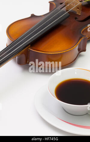 Music break -  Old violin and cup of coffee on the white table Stock Photo