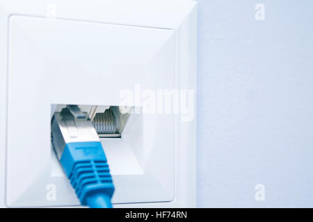 Empty LAN plug-in into the wall outlet Stock Photo