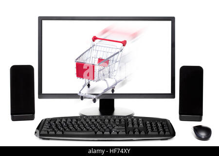 Shopping cart coming out of desktop computer monitor Stock Photo