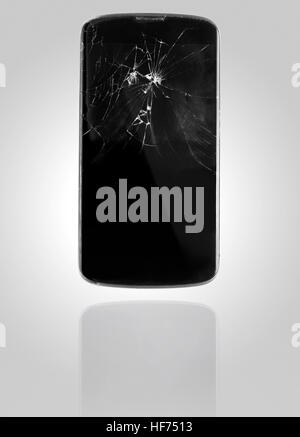 Smartphone with broken screen on graphical background Stock Photo