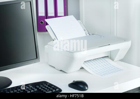 Composition of white printer and black computer in modern office Stock Photo
