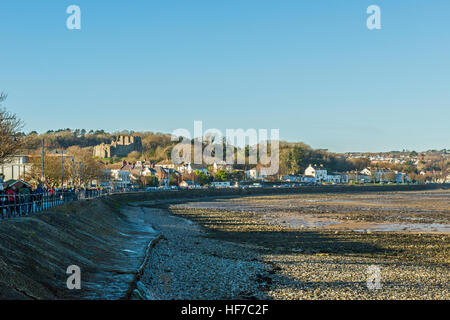 The seafront at Mumbles on the coast of Swansea Bay in south Wales, showing Oystermouth Castle Stock Photo