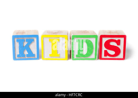 Isolated alphabet blocks on white background spelling out Kids. Stock Photo
