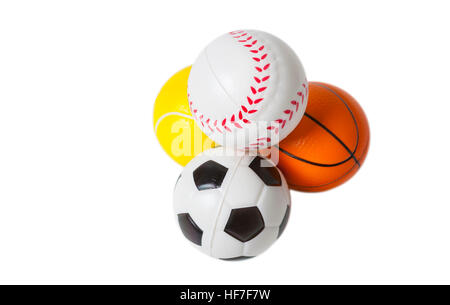 Four toy sports balls isolated on white background. Stock Photo