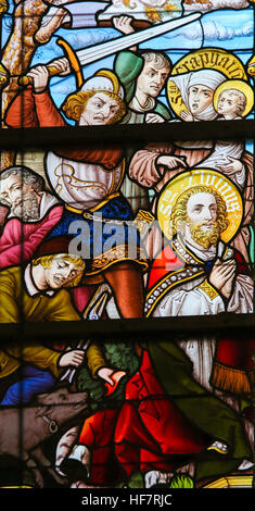 Stained Glass depicting the Martyrdom of Saint Livinus, in the Cathedral of Saint Bavo in Ghent, Belgium. Stock Photo