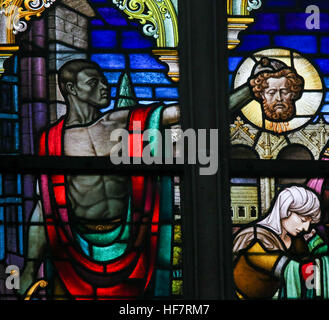 Stained Glass window depicting the Beheading of John the Baptist in the Cathedral of Saint Bavo in Ghent, Flanders, Belgium. Stock Photo