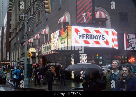 Advertising for TGI Friday's in a storefront in New York containing an assortment of fast food and fast casual restaurants franchised by Reise Restaurants on Sunday, December 18, 2016. (© Richard B. Levine) Stock Photo