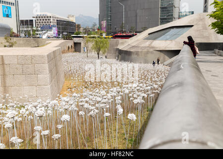 LED Rose Garden, buildings and people next to the Dongdaemun Design Plaza in Seoul, South Korea, in the daytime. Stock Photo
