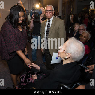 Actress Octavia Spencer, left, who plays Dorothy Vaughan in the film &quot;Hidden Figures&quot; and NASA Administrator Charles Bolden, right, greets NASA &quot;human computer&quot; Katherine Johnson, at a reception to honor NASA's &quot;human computers&quot; on Thursday, Dec. 1, 2016, at the Virginia Air and Space Center in Hampton, VA. Afterward, the guests attended a premiere of &quot;Hidden Figures&quot; a film which stars Taraji P. Henson as Katherine Johnson, the African American mathematician, physicist, and space scientist, who calculated flight trajectories for John Glenn's first orbit Stock Photo