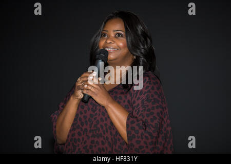 Actress Octavia Spencer, who plays Dorothy Vaughan in the film &quot;Hidden Figures&quot; speaks at the premiere of the film after a reception to honor NASA's &quot;human computers&quot; on Thursday, Dec. 1, 2016, at the Virginia Air and Space Center in Hampton, VA. &quot;Hidden Figures&quot; stars Taraji P. Henson as Katherine Johnson, the African American mathematician, physicist, and space scientist, who calculated flight trajectories for John Glenn's first orbital flight in 1962. Aubrey Gemignani) Stock Photo