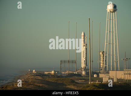 The Orbital ATK Antares rocket, with the Cygnus spacecraft onboard, is seen on launch Pad-0A during sunrise, Sunday, Oct. 16, 2016 at NASA's Wallops Flight Facility in Virginia. Orbital ATK’s sixth contracted cargo resupply mission with NASA to the International Space Station will deliver over 5,100 pounds of science and research, crew supplies and vehicle hardware to the orbital laboratory and its crew.
