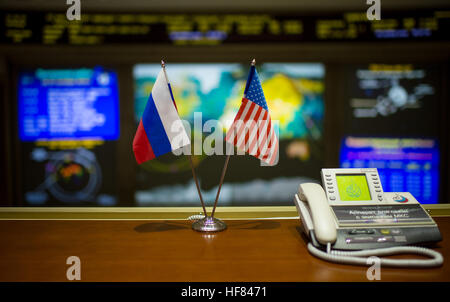 The flags of countries representing the crew members of the Soyuz MS-02 spacecraft are seen at the Moscow Mission Control Center as the spacecraft approaches for docking, Friday, Oct. 21, 2016 in Korolov, Russia. The Soyuz MS-02 spacecraft carrying Shane Kimbrough of NASA, Sergey Ryzhikov of Roscosmos, and Andrey Borisenko of Roscosmos docked with the International Space Station at 5:52 a.m. EDT Friday, Oct. 21, 251 statute miles over southern Russia and joined Expedition 49 Commander Anatoly Ivanishin of Roscosmos and flight engineers Kate Rubins of NASA and Takuya Onishi of the Japan Aerospa Stock Photo