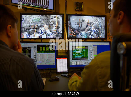 Expedition 50 crew members ESA astronaut Thomas Pesquet, Russian cosmonaut Oleg Novitskiy of Roscosmos, and NASA astronaut Peggy Whitson are seen on the monitors of the Soyuz simulator control room during final qualification exams, Tuesday, Oct. 25, 2016, at the Gagarin Cosmonaut Training Center (GCTC) in Star City, Russia. Stock Photo