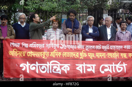 Dhaka, Bangladesh. 27th Dec, 2016. Bangladesh Ganatantrik Bam Morch (Democratic Left Alliance) calls a protest in front of the national press Club, demanded raising the minimum wages for employees of the readymade garment sector to Tk 16,000 (202 USD) a month and release of all workers who have been arrested during recent the demonstrations in Ashulia garments hub. © Md. Mehedi Hasan/Pacific Press/Alamy Live News Stock Photo