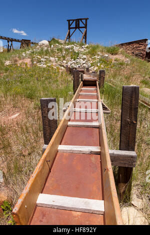 Old gold mining sluice and head frame. Stock Photo