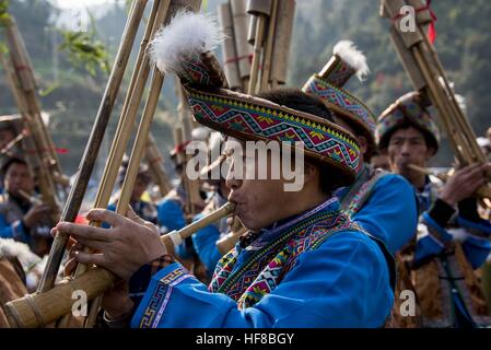 Congjiang, China. 27th Dec, 2016. More than 2,000 people of ethnic minorities attend the reed-pipe wind instrument playing competition in Congjiang, southwest China's Guizhou Province, December 27th, 2016. It's local tradition to hold reed-pipe wind instrument playing competition, celebrating the harvest and upcoming New Year. © SIPA Asia/ZUMA Wire/Alamy Live News Stock Photo