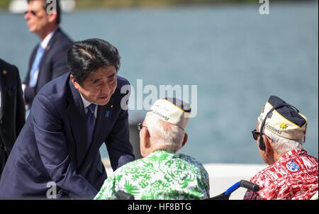 Pearl Harbour, Hawaii. 27th Dec, 2016. Japanese Prime Minister Shinzo Abe greets survivors of the attack on Pearl Harbor during a visit with U.S President Barack Obama to the USS Arizona Memorial December 27, 2016 in Pearl Harbor, Hawaii. Abe is the first Japanese leader to publicly view the site of the Pearl Harbor Attack. Credit: Planetpix/Alamy Live News Stock Photo