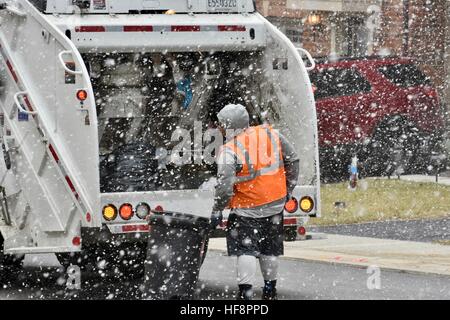 Hanover, Maryland, USA. 30th December, 2016. The Anne Arundel County garbage team is driving through neighborhoods while collecting trash on a snowy winter day in Anne Arundel County Maryland. Credit: Jeramey Lende/Alamy Live News Stock Photo