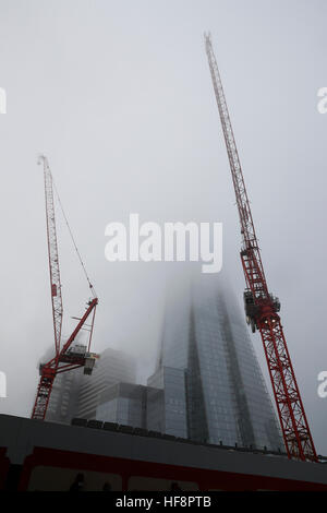 London, UK. 30th Dec, 2016. Photo taken on Dec. 30, 2016 shows the Shard in fog in London, Britain. © Han Yan/Xinhua/Alamy Live News Stock Photo
