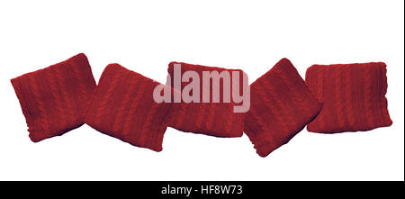 red knitted pillows isolated on white background Stock Photo
