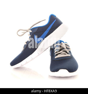 Nike Tanjun Trainers in blue, Taken at studio isolated over a background Stock Photo - Alamy