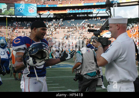 Nov 05, 2006; Chicago, IL, USA; Miami Dolphinns at Chicago Bears NFL  football game. Bears #94 Brendon Ayanbadejo talks with Nick Saban and Randy  McMichael after the game. Mandatory Credit: Photo by