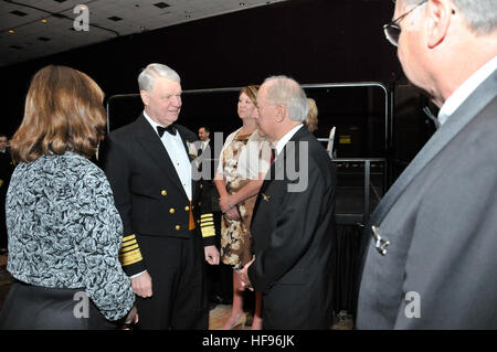 U.S. Navy Adm. Gary Roughead, second from left, chief of naval operations, speaks to another attendee at the 2011 Scholarship Awards Banquet and Women in Aviation International Pioneer Hall of Fame Induction Ceremony during the 22nd Annual WAI Conference in Reno, Nev., Feb. 26, 2011. (U.S. Navy photo by Chief Mass Communication Specialist Tiffini Jones Vanderwyst/Released) Chief of Naval Operations Adm. Roughead 110226-N-FI224-014 Stock Photo