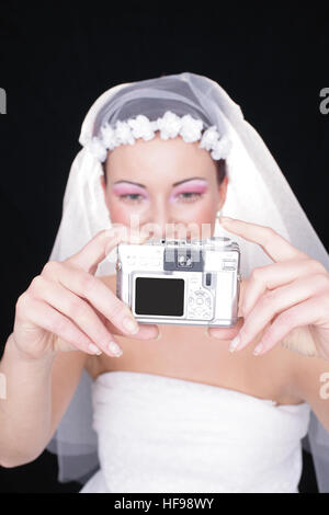 Bride photographing herself Stock Photo
