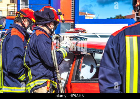 firemen during a car accident simulation Stock Photo