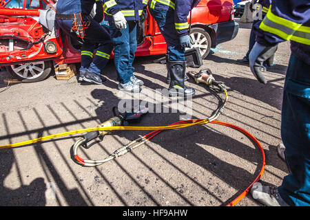 firemen during a car accident simulation Stock Photo