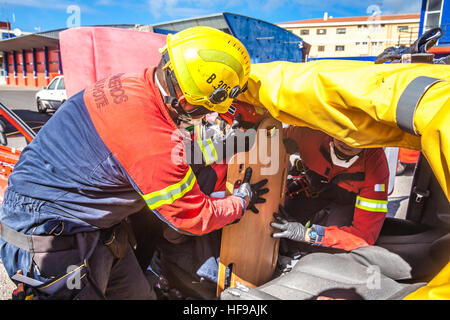 firemen during a car accident simulation Stock Photo