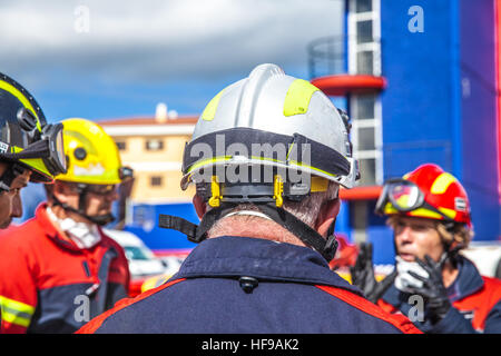 firemen during a car accident simulation Stock Photo