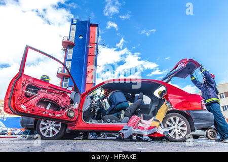 firemen during a car accident simulation Stock Photo