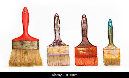 set of used brushes with bits of dried paint on white background Stock Photo