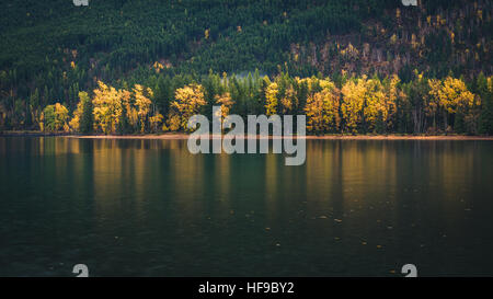 Autumn colors reflected in a lake. Stock Photo